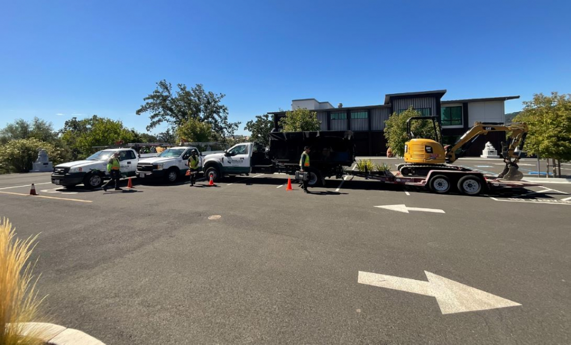 Philco trucks and equipment parked in a commercial clients parking lot